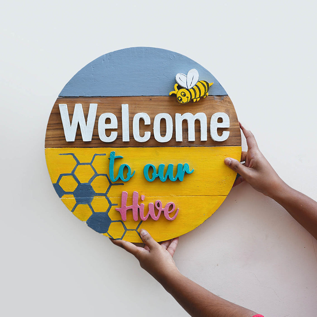 Hand Painted Personalized Bee Themed Wooden Name Plate - Front View Held by Hands