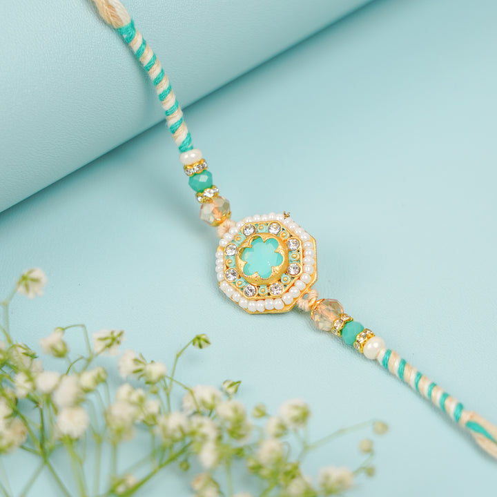 Handmade Sea Green Judtar Rakhi With Roli Chawal - Close-up of Decorative Thread Detail