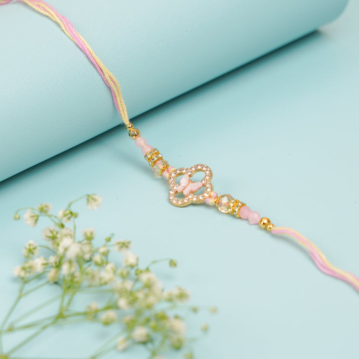 Handmade Buttefly Theme Rakhi With Roli Chawal - Close-up of Pink Threaded Bracelet