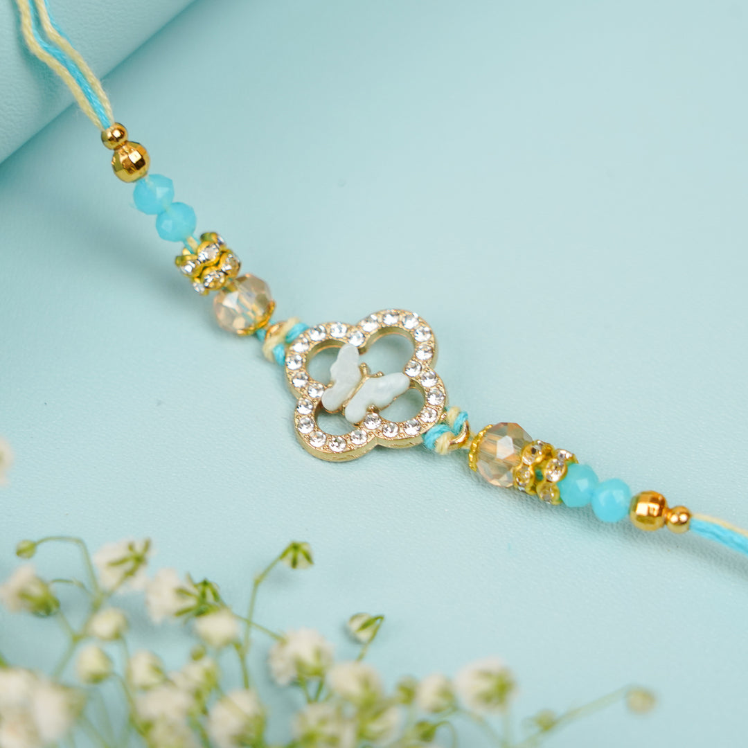 Handmade Buttefly Theme Rakhi With Roli Chawal - Close-up of Blue Threaded Bracelet