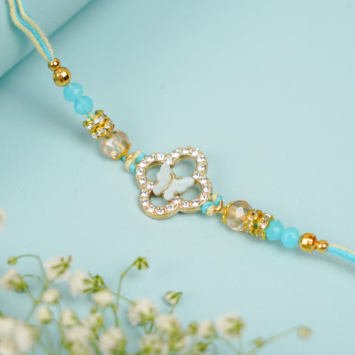 Handmade Buttefly Theme Rakhi With Roli Chawal - Close-up of Blue Threaded Bracelet