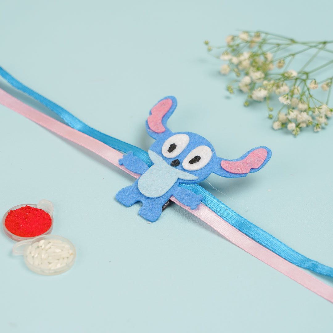 Handmade Stitch Theme Felt Kids Rakhi With Roli Chawal - Flat Lay Display with Accessories