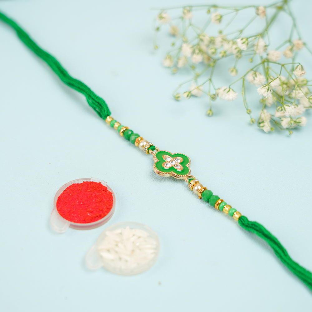 Handmade Green Jadtar Rakhi With Roli Chawal - Front View with Decorative Items