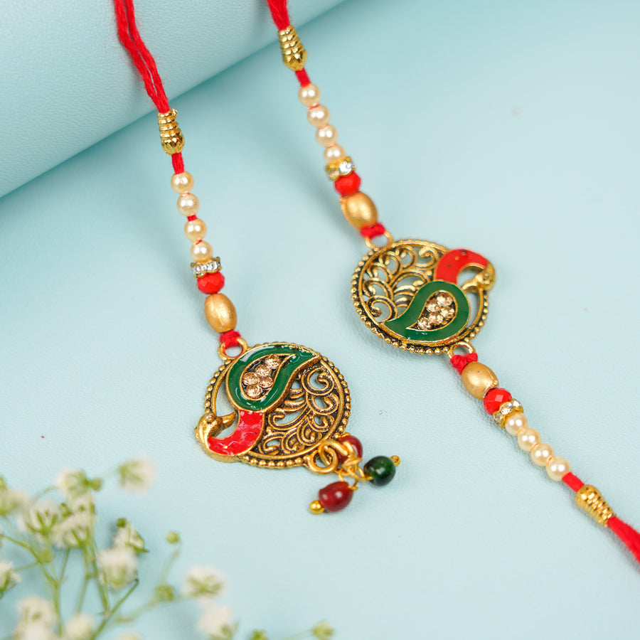 Handmade Peacock Jadtar Bhaiya Bhabhi Rakhi With Roli Chawal Set Of 2 - Pair Display on Flat Surface