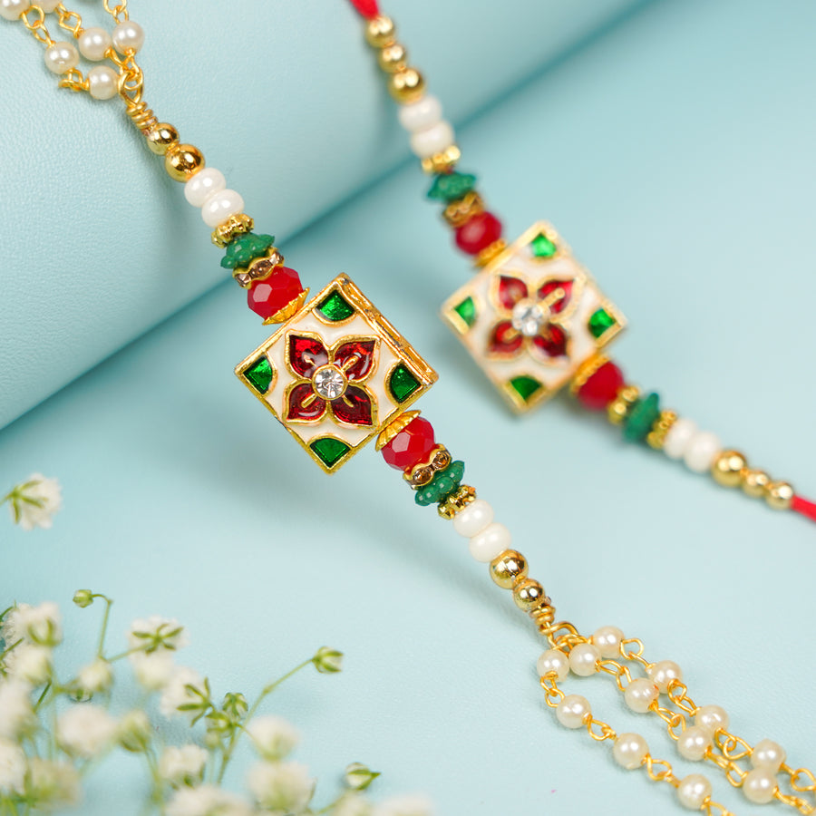 Handmade Square Jadtar And Pearl Bhaiya Bhabhi Rakhi With Roli Chawal Set Of 2 - Close-up of central embellishment