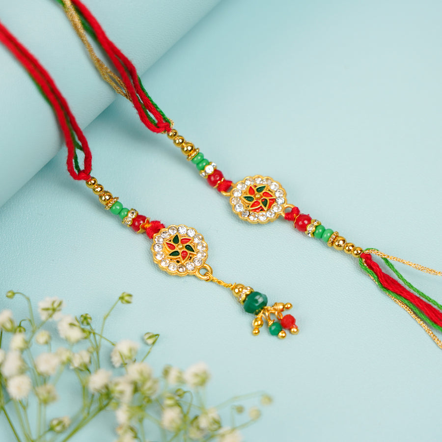 Handmade Red And Green Bhaiya Bhabhi Rakhi With Roli Chawal Set Of 2 - Pair Display with Floral Accent