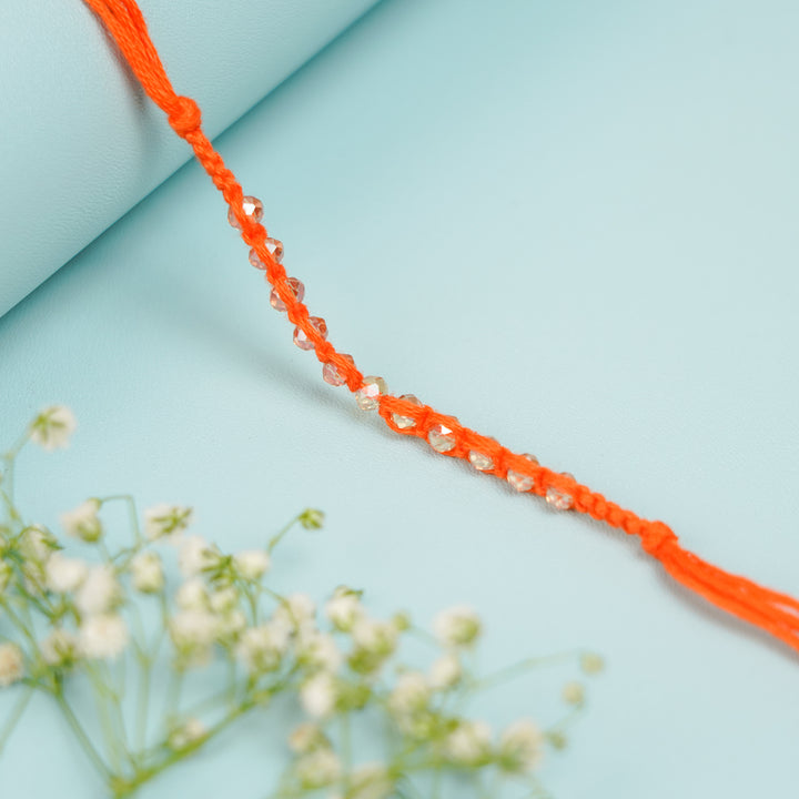 Handmade Jadtar Crystal Bhaiya Bhabhi Rakhi With Roli Chawal Set Of 2 - Side angle of beaded string section
