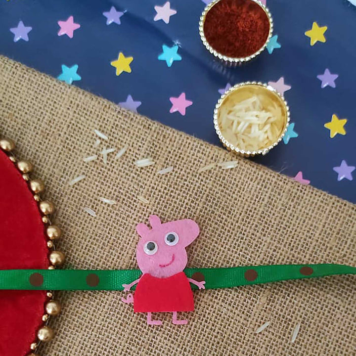 Personalized Handmade Peppa Pig Theme Felt Kids Rakhi And Photo Frame Combo For Kids Set Of 2 - Close-up of Rakhi Design