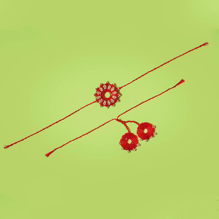 Handcrafted Bhaiya Bhabhi Square Rakhi Set Green - Red ornamental rakhis flat lay