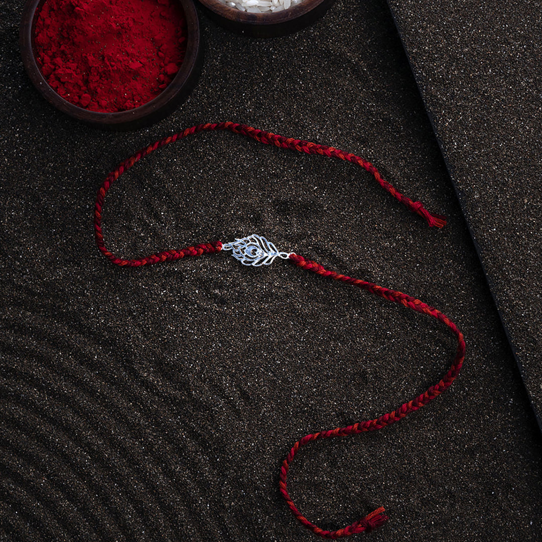 Handmade Peacock 925 Silver Rakhi With Roli Chawal For Brother - Full Product Layout on Surface