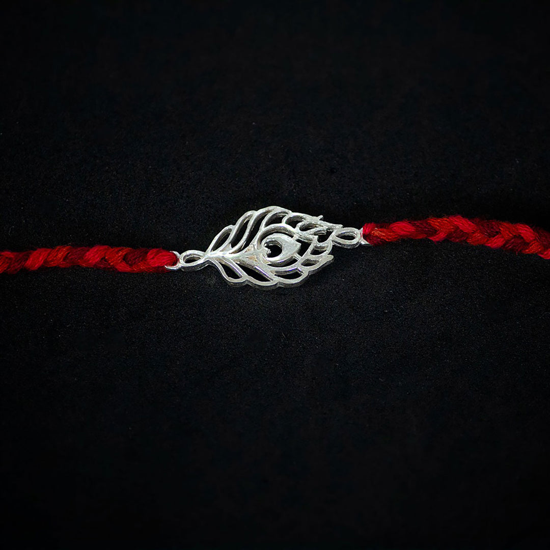 Handmade Peacock 925 Silver Rakhi With Roli Chawal For Brother - Close-up of Central Charm
