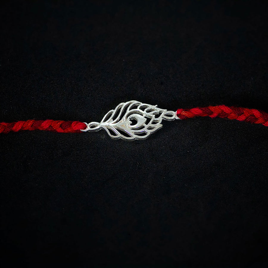 Handmade Peacock 925 Silver Rakhi With Roli Chawal For Brother - Close-up of Central Charm