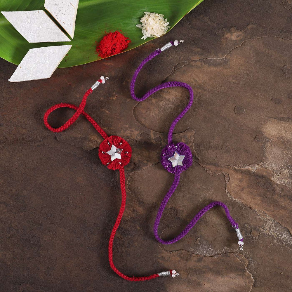 Handmade Mirror Work Floral Rakhi With Roli Chawal Set Of 2 - Top View with Festival Elements