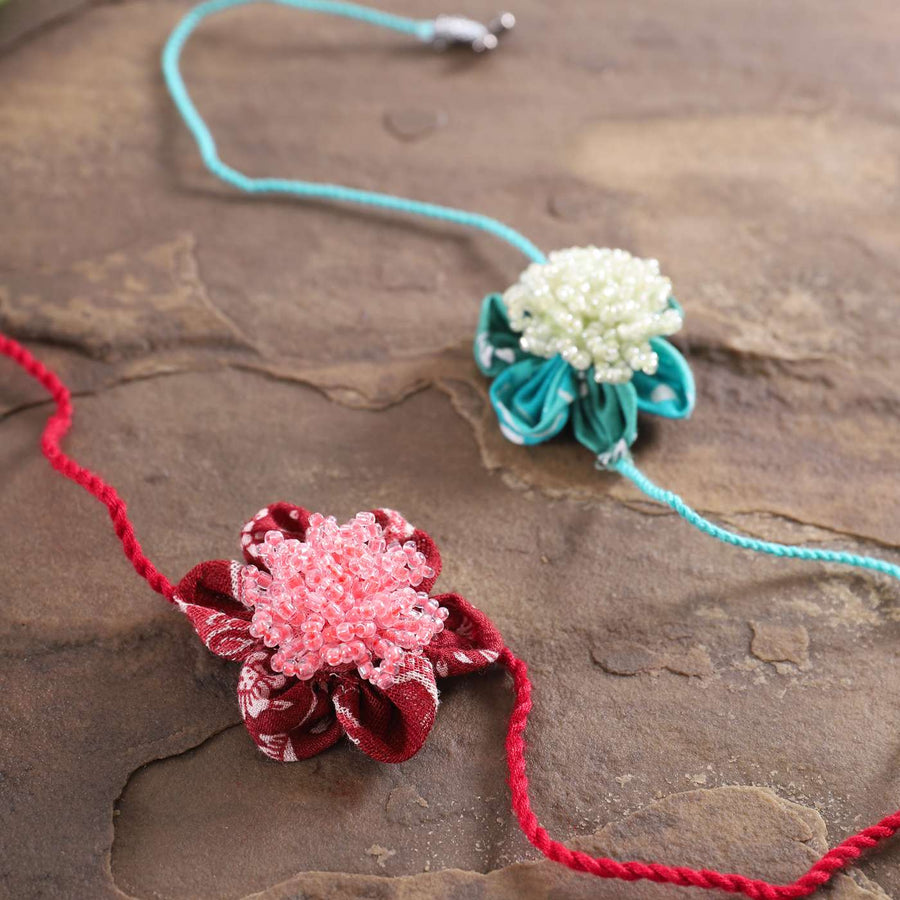 Handmade Beaded Floral Moti Rakhi With Roli Chawal Set Of 2 - Close-up of Flower Bracelet Details