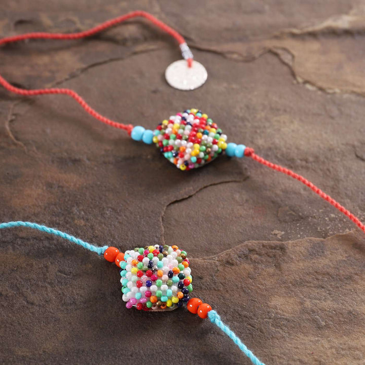 Handmade Beaded Square Rakhi With Roli Chawal Set Of 2 - Close-up of Beaded Centerpiece