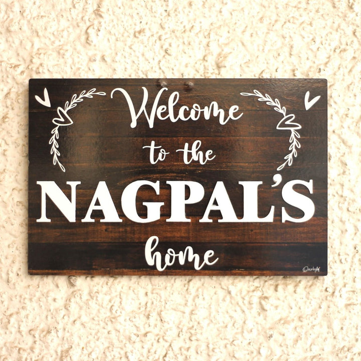 Personalized Printed Welcome To Our Home Mdf Wood Name Plate With 3D Letters - Front View Mounted on Wall