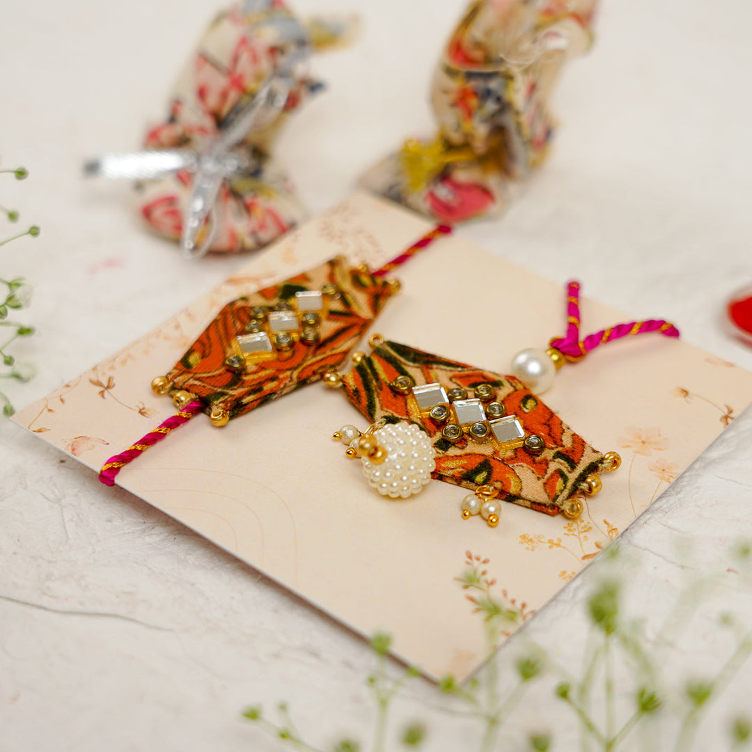 Handmade Sequin Embroidery Hexagon Kundan Bhaiya Bhabhi Rakhi With Roli Chawal Set Of 2 - Pair Angled Close-up on Card