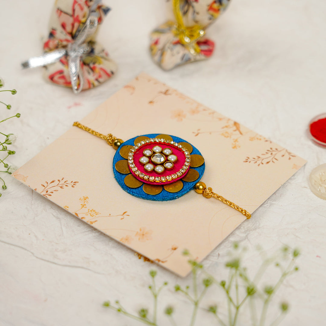 Handmade Mandala Kundan Flower Rakhi With Roli Chawal - Angled Side View with Accessories (6)