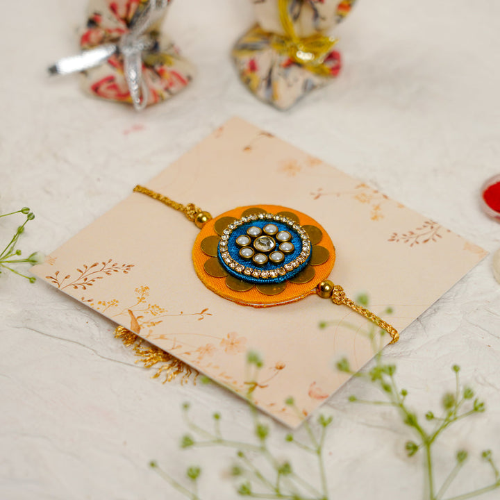 Handmade Mandala Kundan Flower Rakhi With Roli Chawal - Angled Side View with Accessories (12)