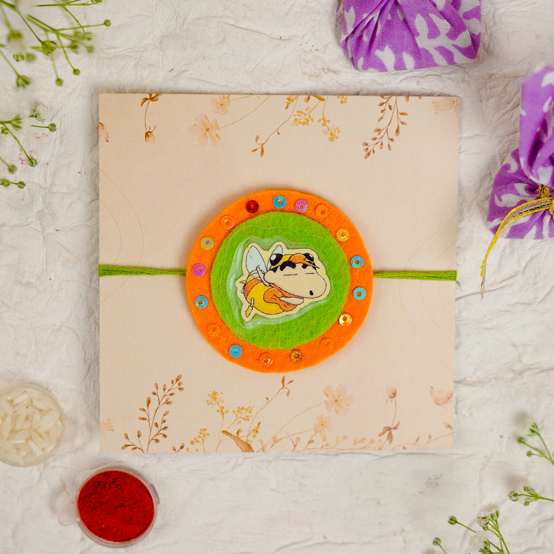 Handmade Shinchan Kids Rakhi With Roli Chawal - Front View on Decorative Envelope