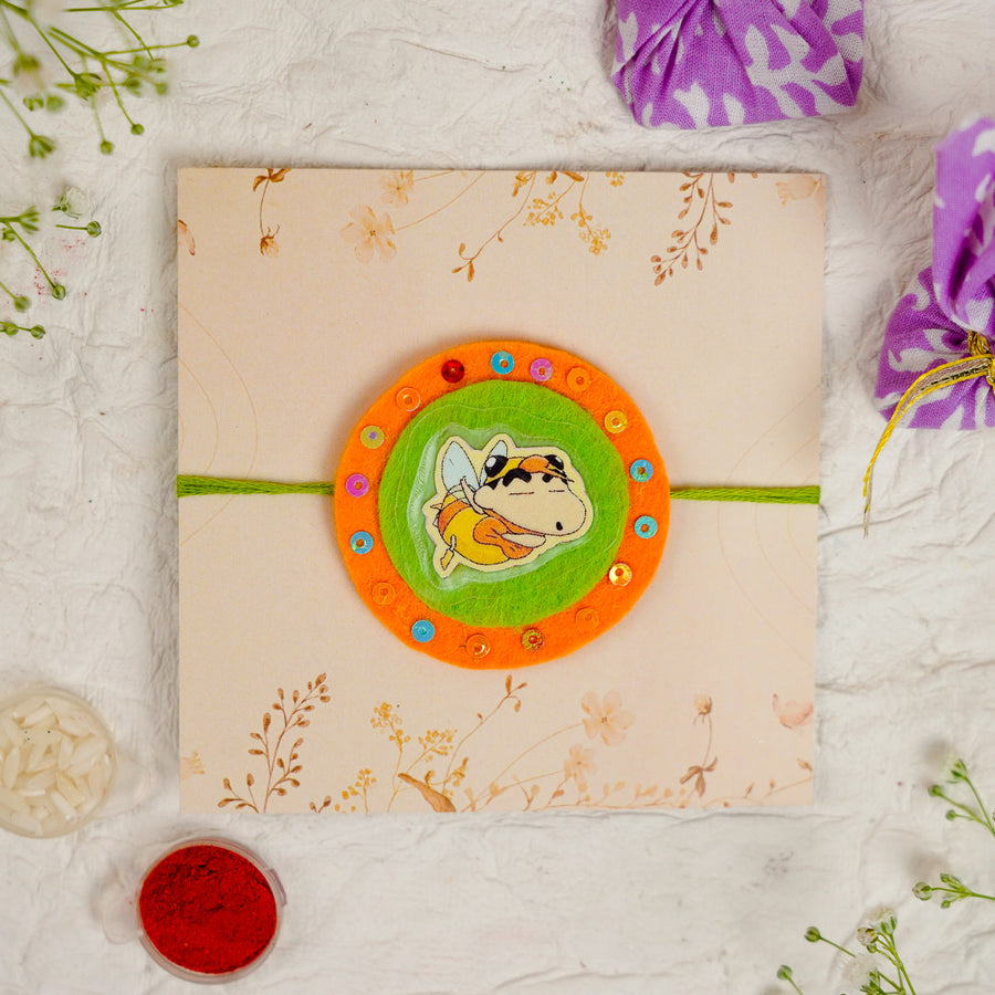 Handmade Shinchan Kids Rakhi With Roli Chawal - Front View on Decorative Envelope