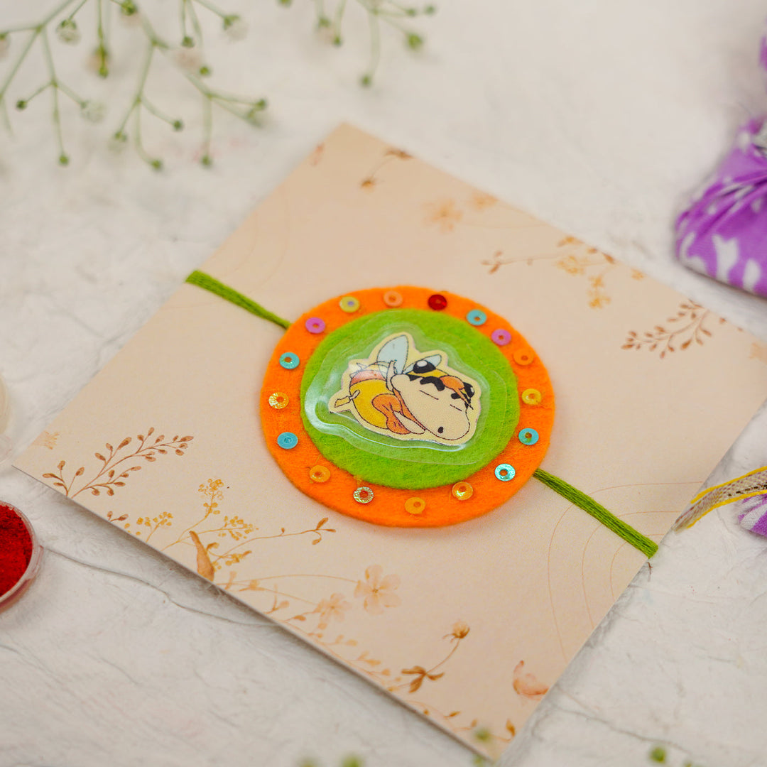 Handmade Shinchan Kids Rakhi With Roli Chawal - Angled View with Packaging