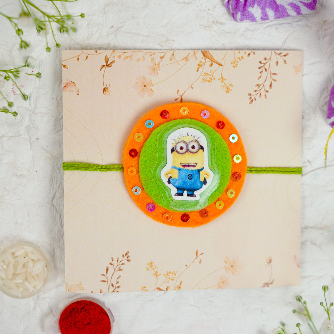 Handmade Minion Kids Rakhi With Roli Chawal - Front View on Packaging