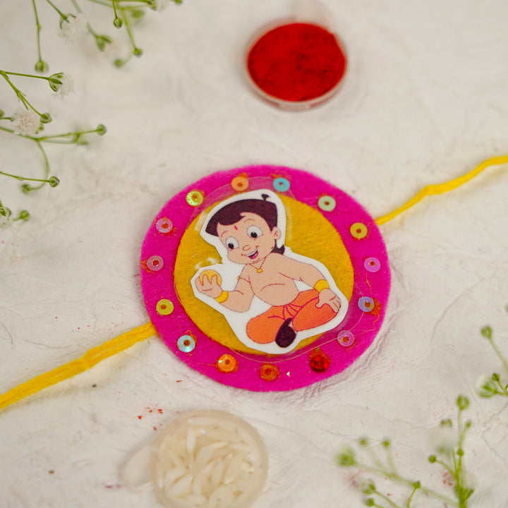 Handmade Chota Bheem With Ladoo Rakhi With Roli Chawal - Close-up of Rakhi Design