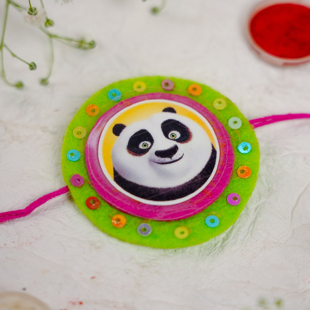 Handmade Kung Fu Panda Kids Rakhi With Roli Chawal - Close-up on Flat Surface (5)