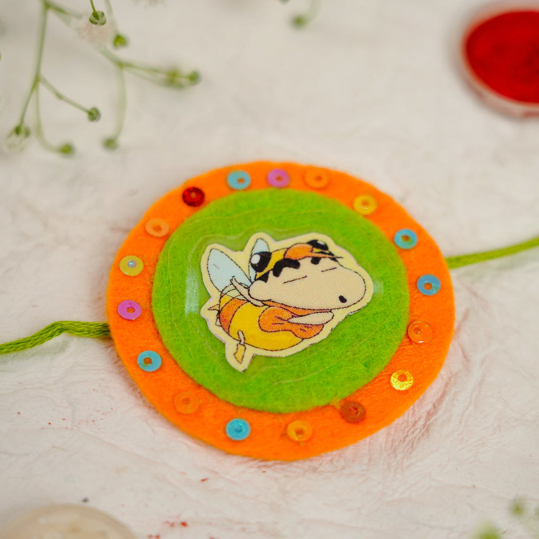 Handmade Shinchan Kids Rakhi With Roli Chawal - Close-up of Center Design