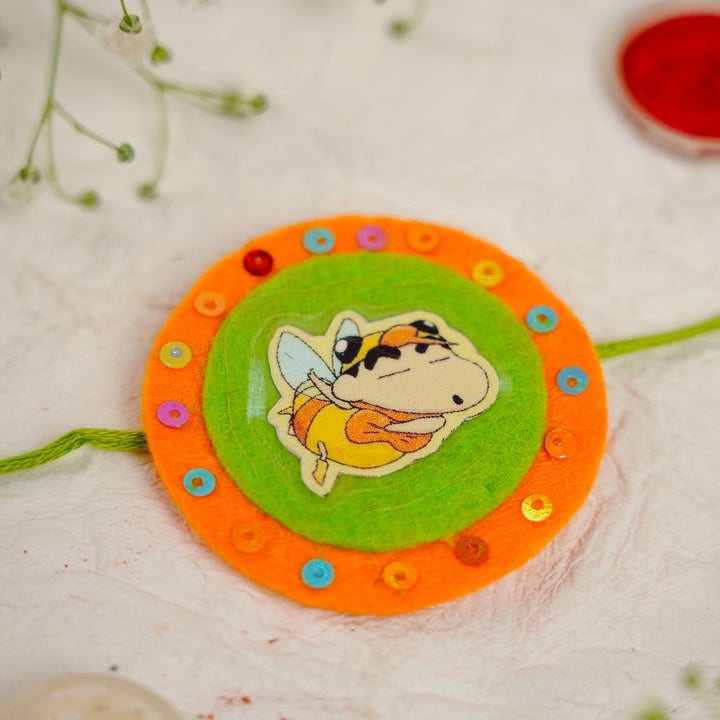 Handmade Shinchan Kids Rakhi With Roli Chawal - Close-up of Center Design