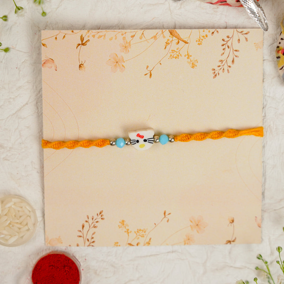 Handmade Hello Kitty Kids Rakhi With Roli Chawal - Straight Laid Flat Packaging View