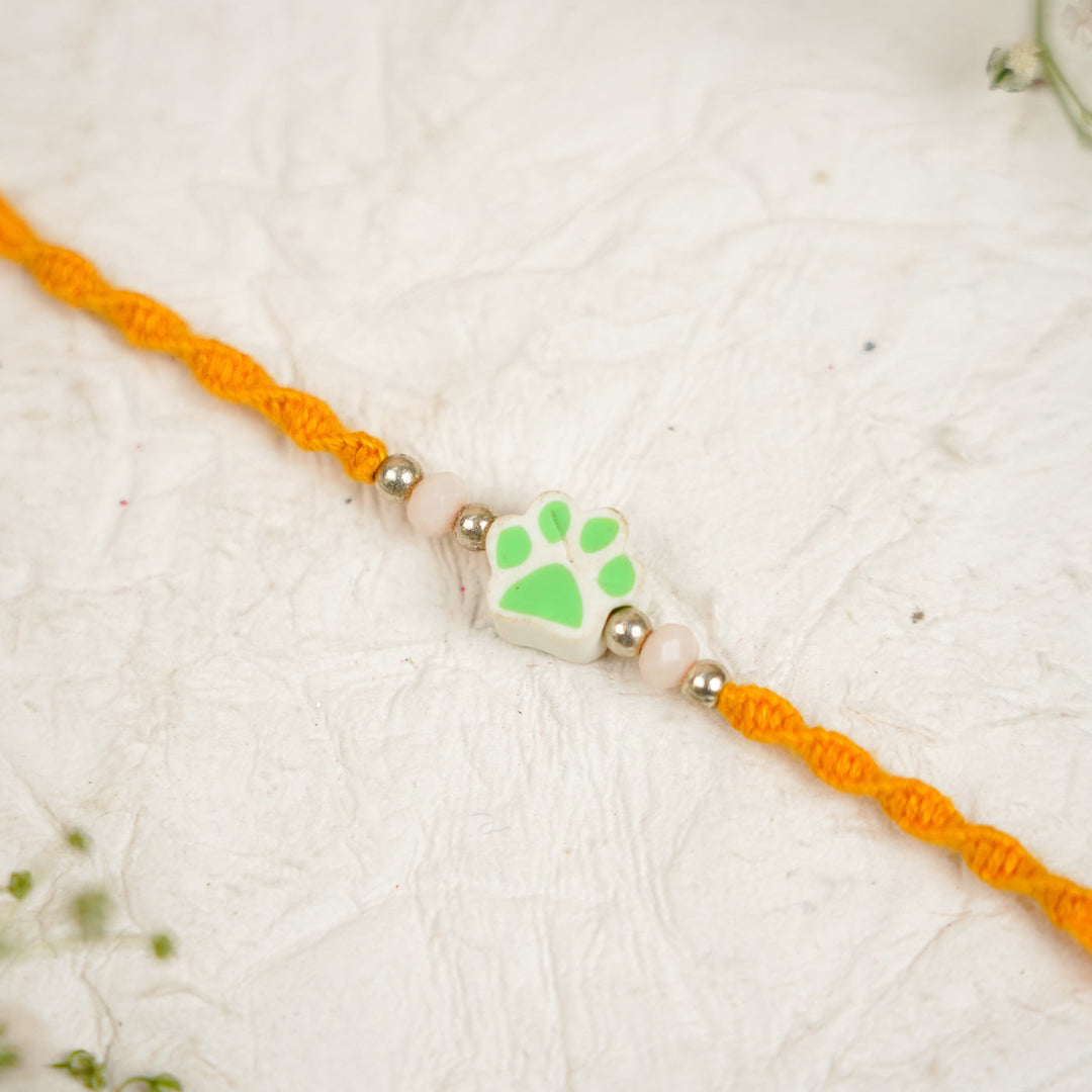 Handmade Paw Kids Rakhi With Roli Chawal - Close-up Blue Paw Charm (17)