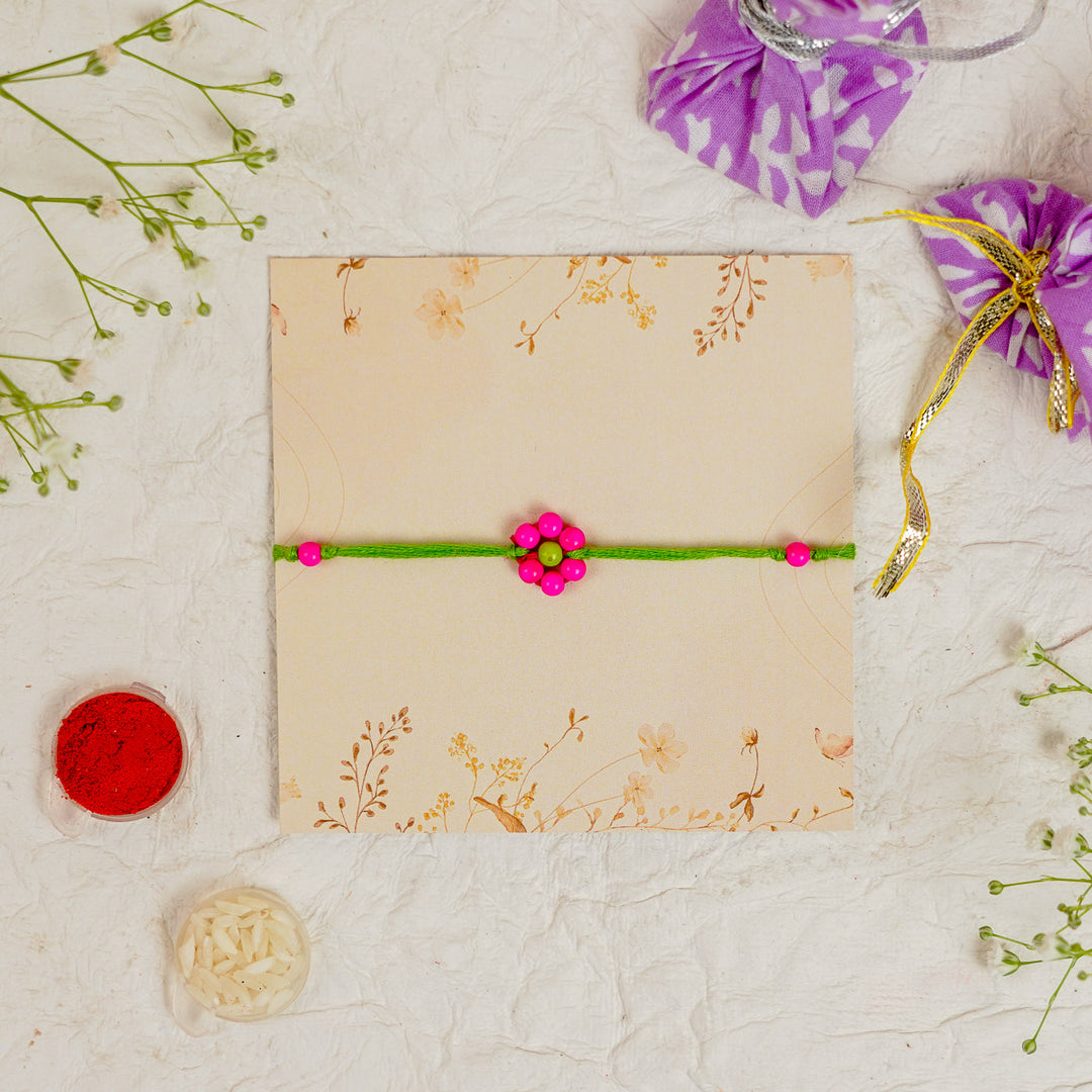Handmade Beaded Flower Rakhi With Roli Chawal - Flat lay with box and accessories (10)