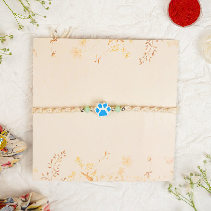 Handmade Paw Kids Rakhi With Roli Chawal - Front View Blue Paw Charm (16)