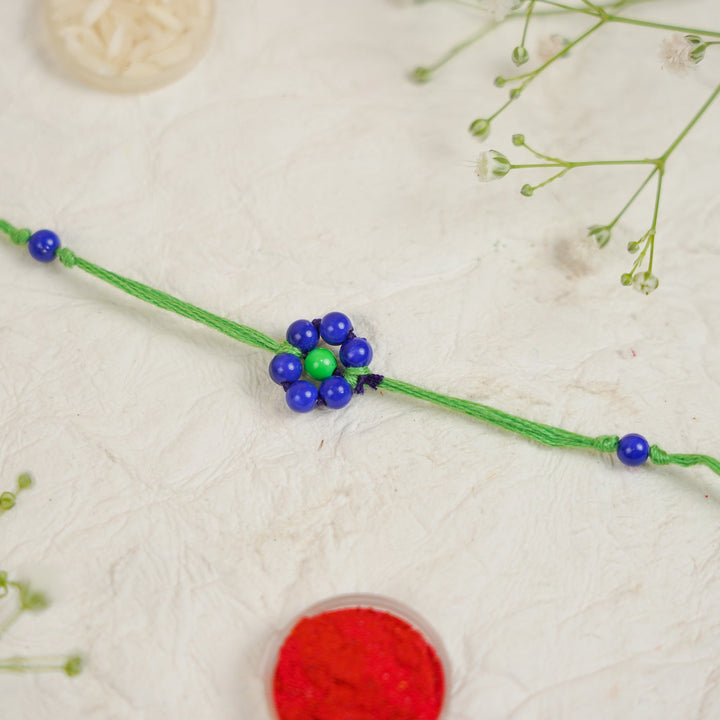 Handmade Beaded Flower Rakhi With Roli Chawal - Close-up of single bracelet (3)