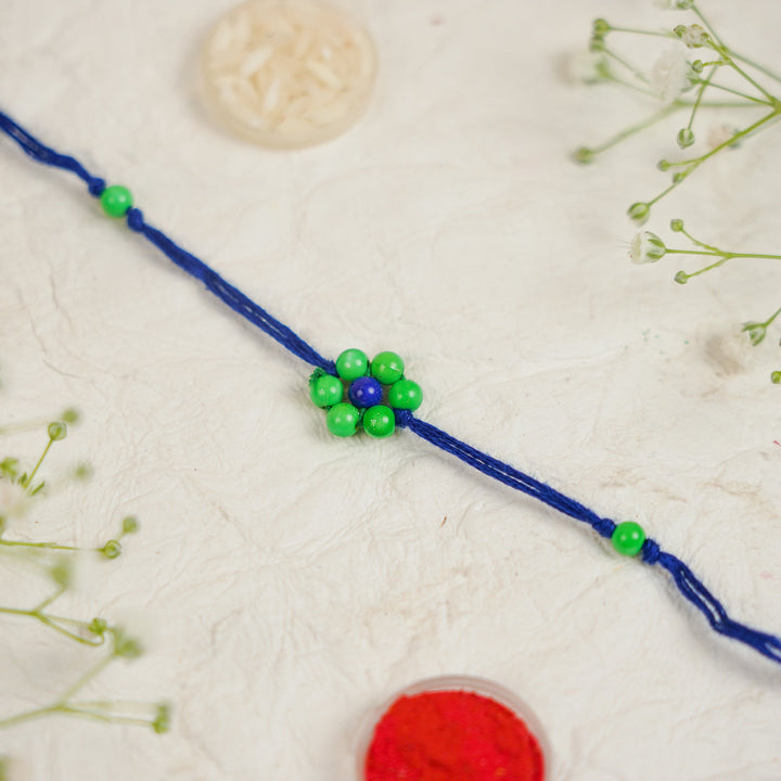 Handmade Beaded Flower Rakhi With Roli Chawal - Flat lay with box and accessories (20)