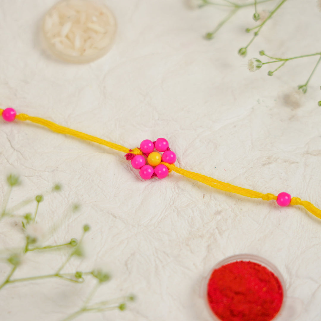 Handmade Beaded Flower Rakhi With Roli Chawal - Flat lay with box and accessories (22)