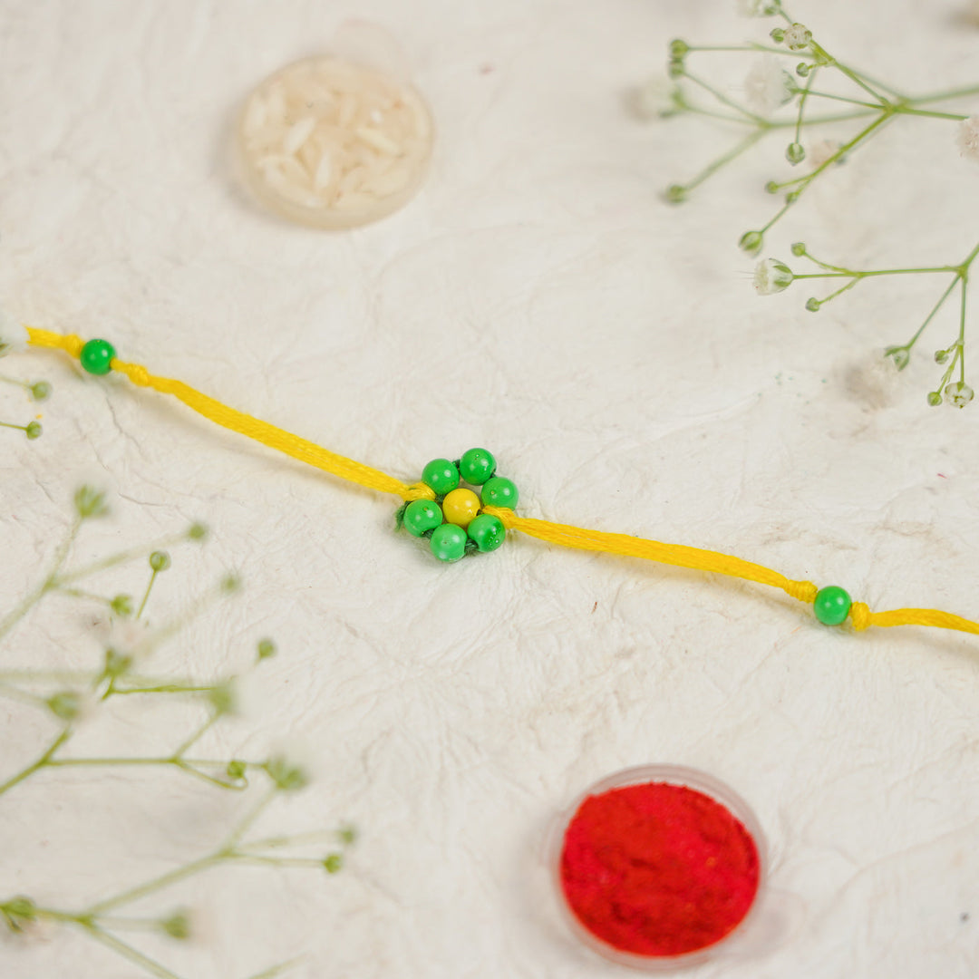 Handmade Beaded Flower Rakhi With Roli Chawal - Close-up of single bracelet (11)