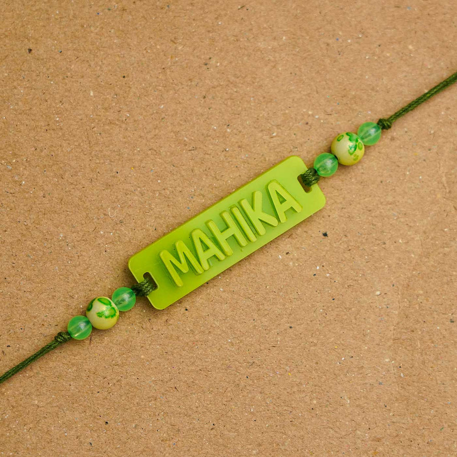 Personalized Handmade Neon Name Acrylic Rakhi With Roli Chawal - Close-up of name detail