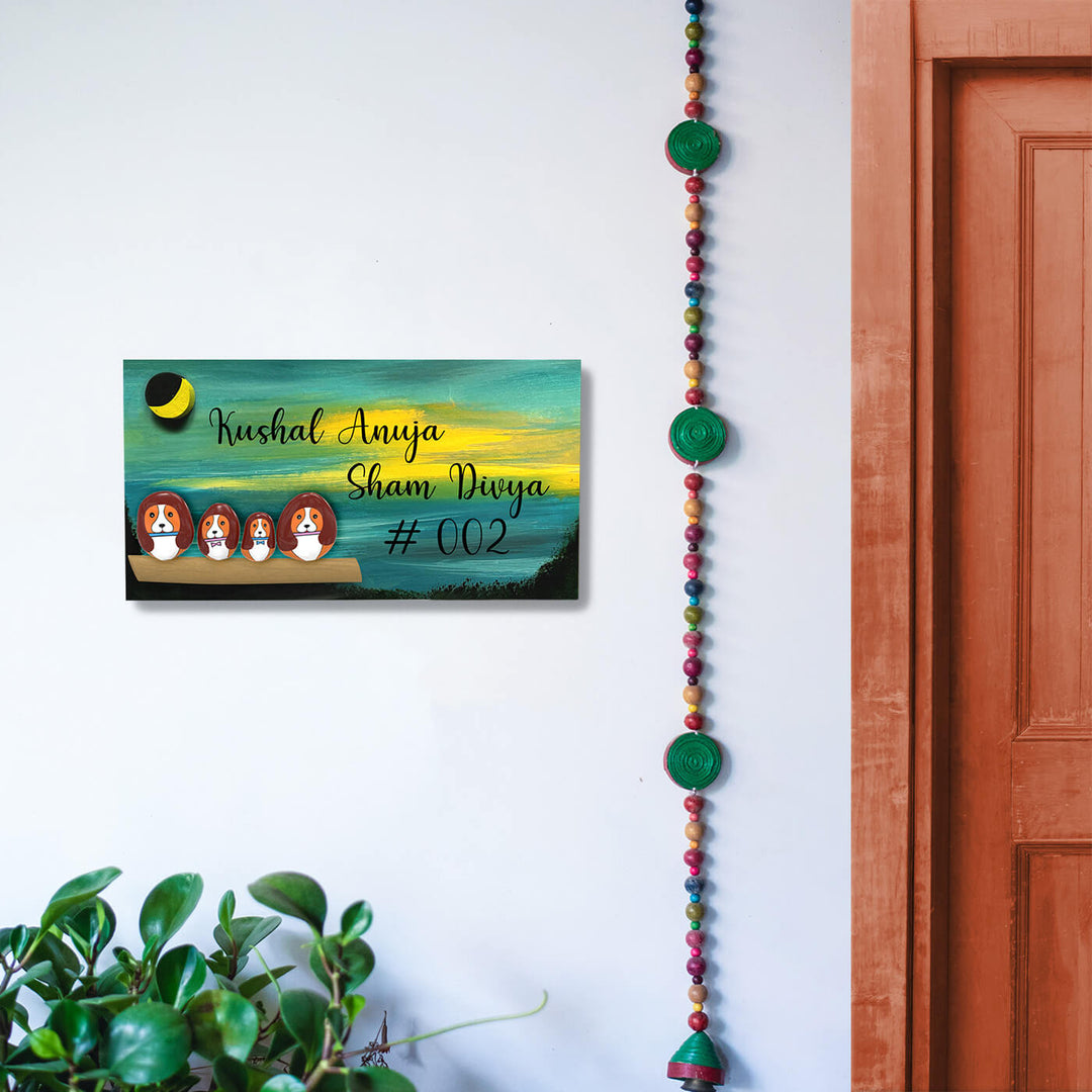 Hand Painted Pebble Art Name Plate For Family Of 4 - Mounted on White Wall Interior