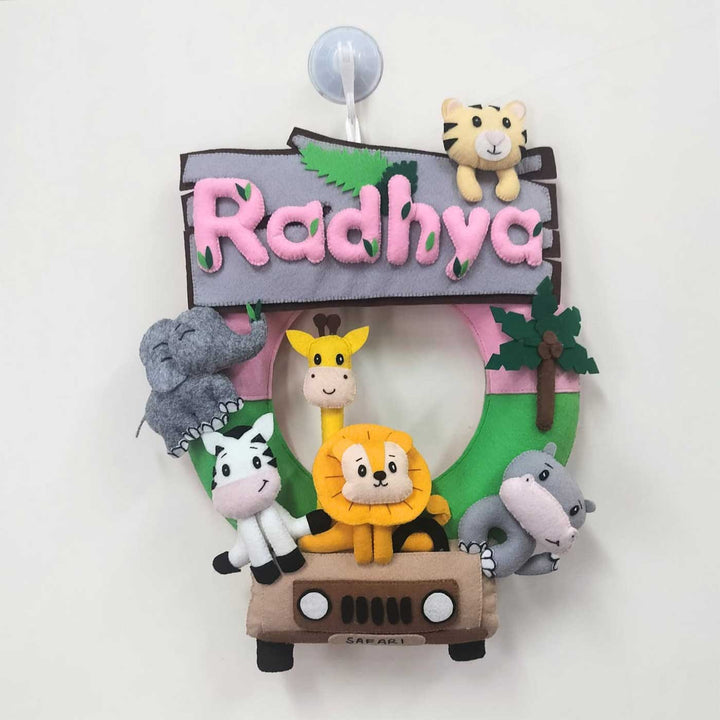 Personalized Jungle Safari Themed Round Felt Kids Nameplate Pink - Front View Hanging on Suction Hook