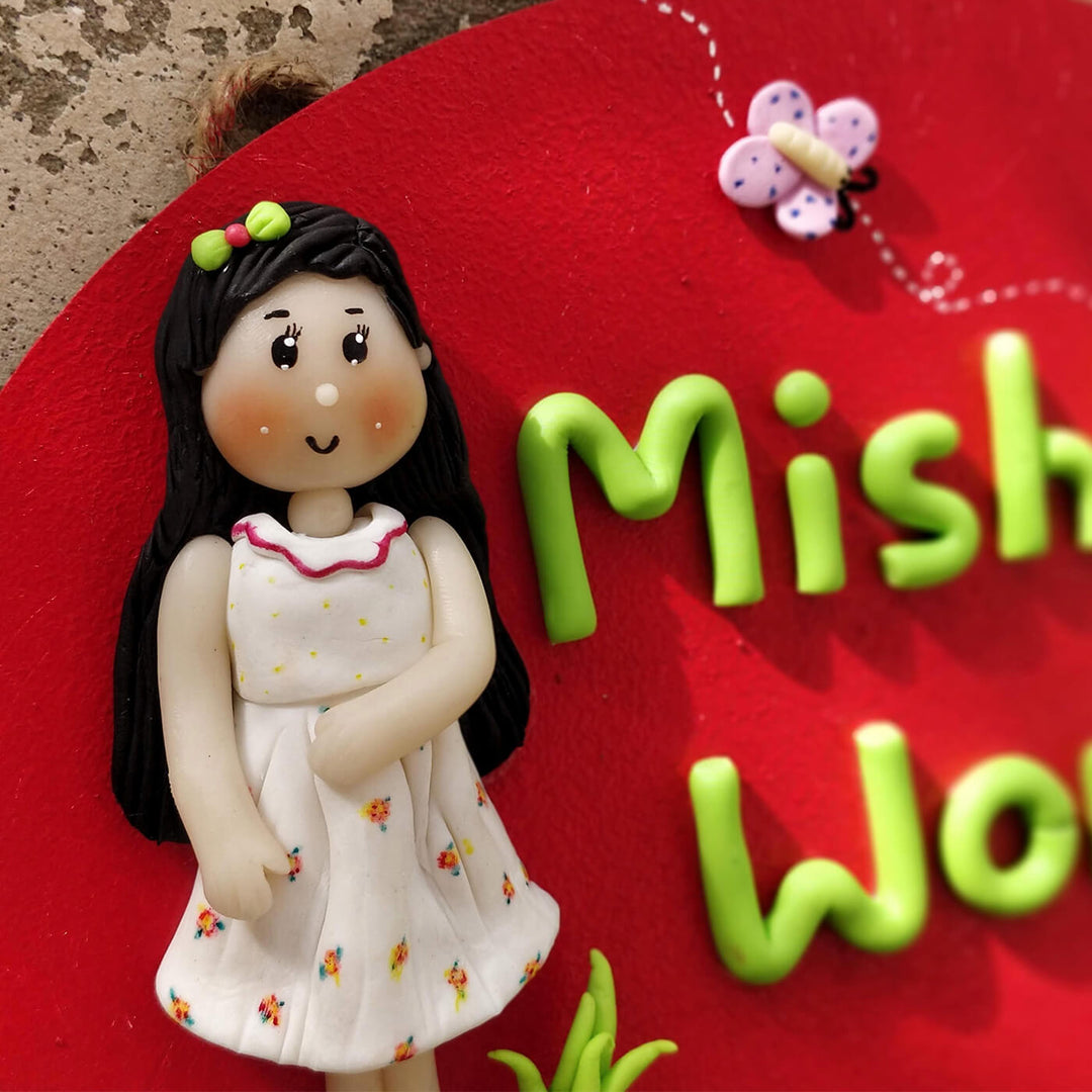 Handcrafted Personalized Clay Caricature Name Plate For Girls - Close-up on Figurine Detail
