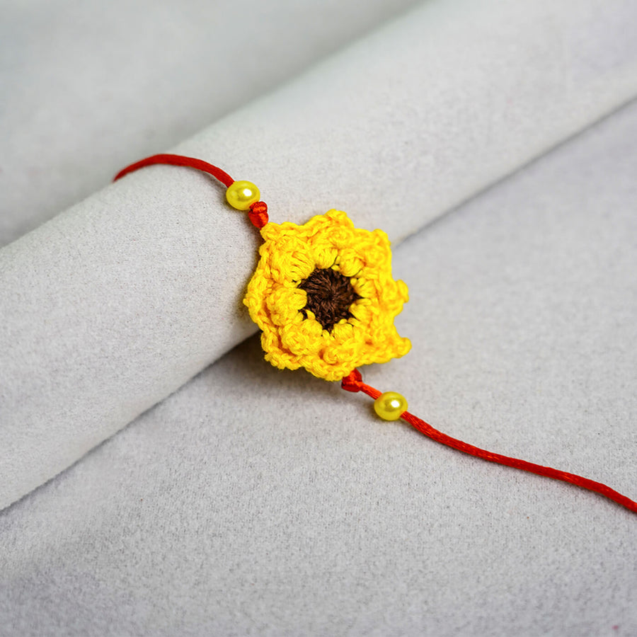 Floral Handcrafted Crochet Rakhi With Roli Chawal For Kids 1 - Close-up Front View