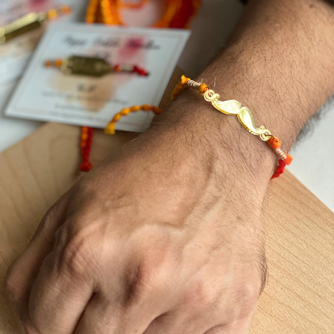 Handcrafted Golden Acrylic Rakhi With Roli Chawal 1 - Worn on Wrist