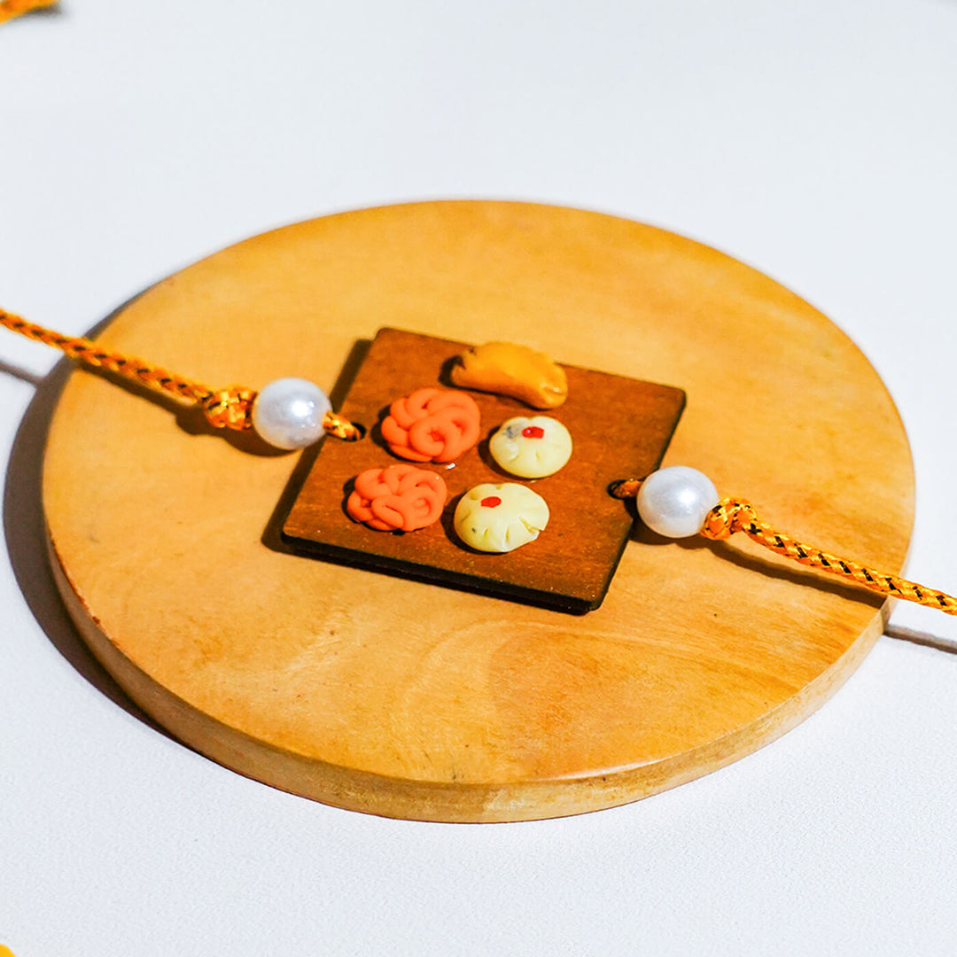 Handmade Food Themed Clay Rakhi 2 - Macro detail of Rakhi centerpiece