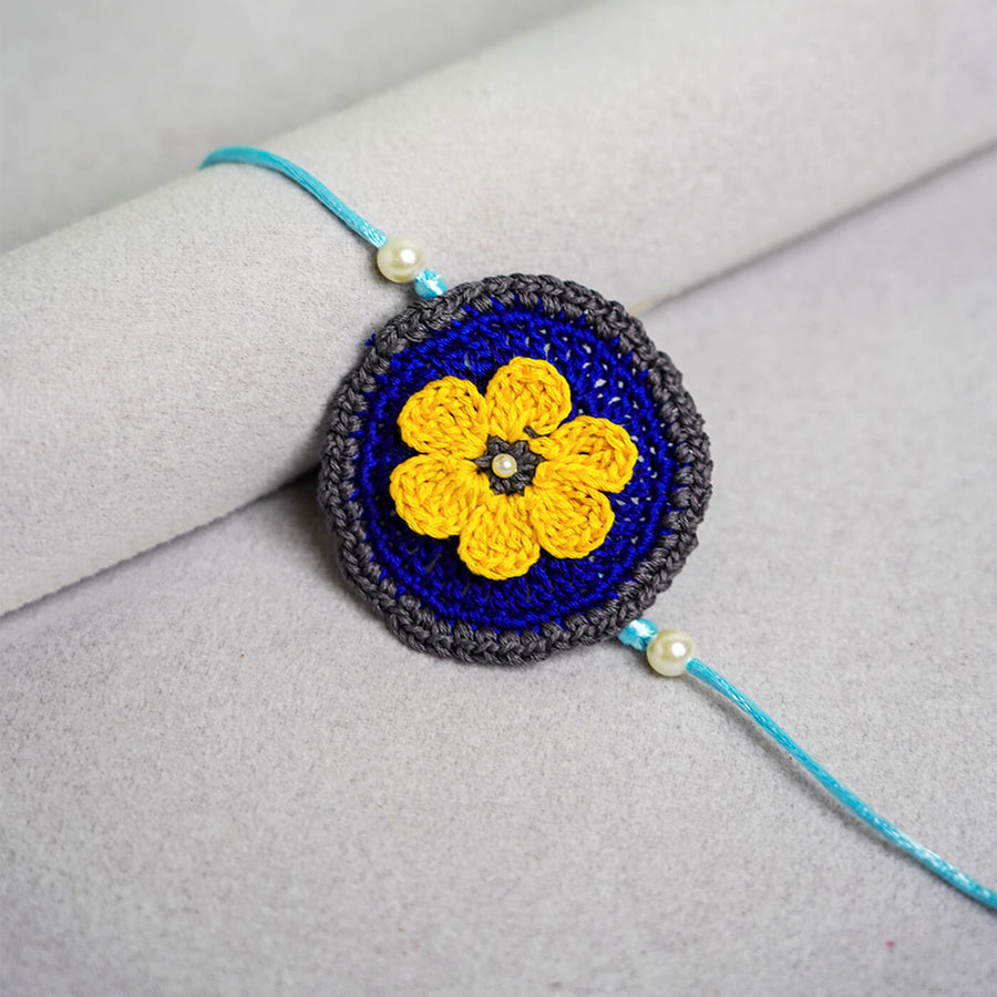 Floral Handcrafted Crochet Rakhi With Roli Chawal For Kids - Close-up Front View