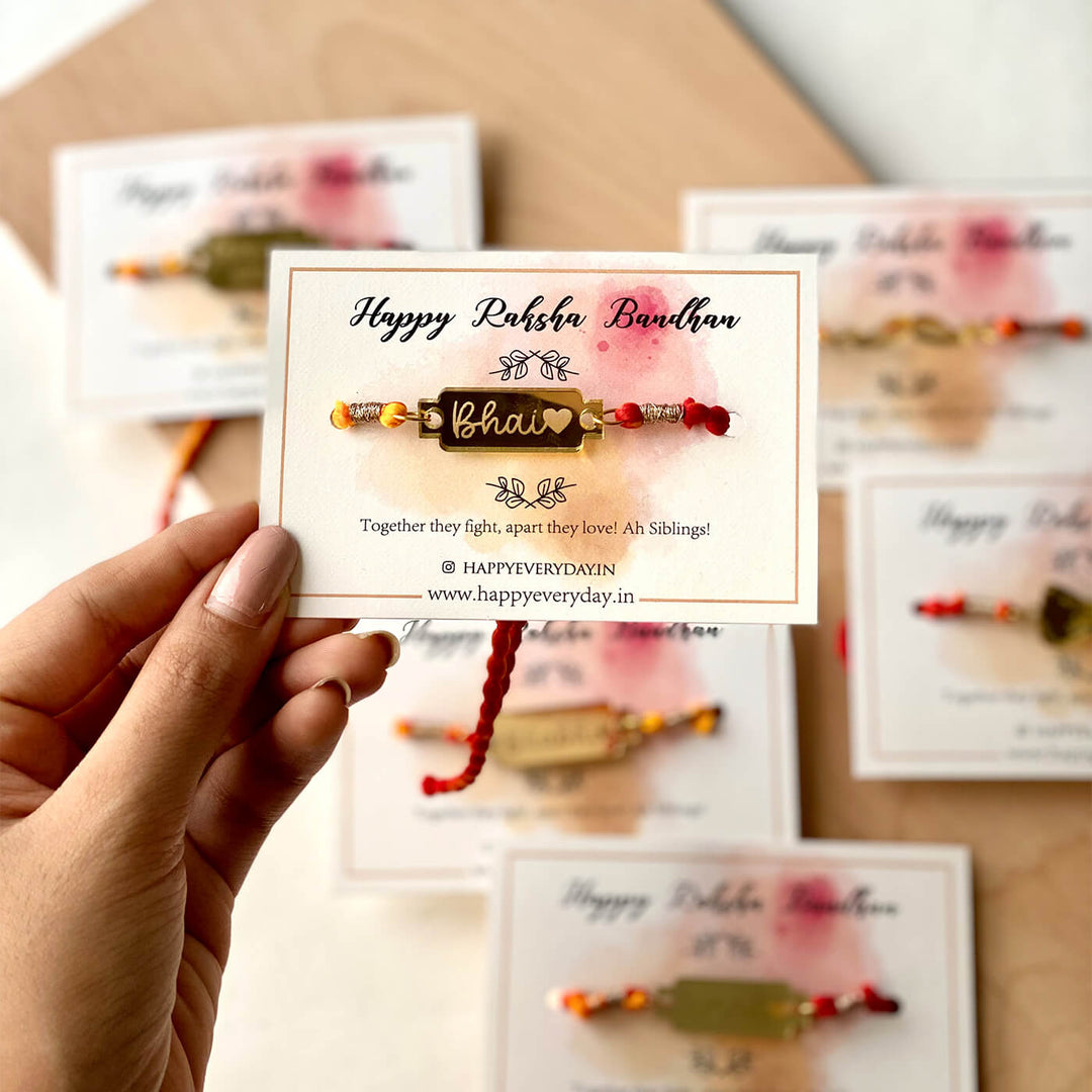 Handcrafted Golden Acrylic Rakhi With Roli Chawal 1 - Front View with Hand Holding