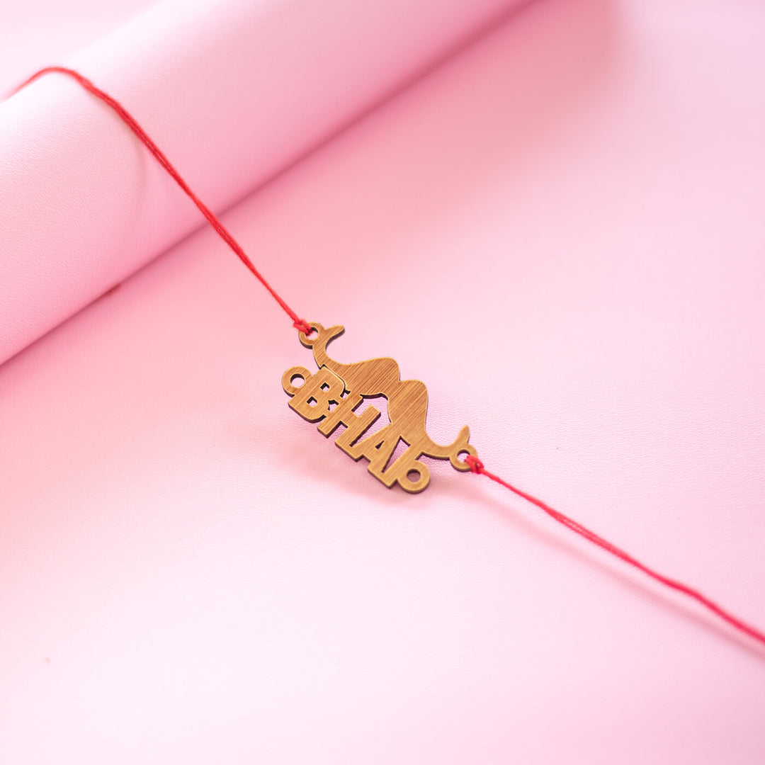 Classic Bhai Rakhi - Angled close-up on pink background