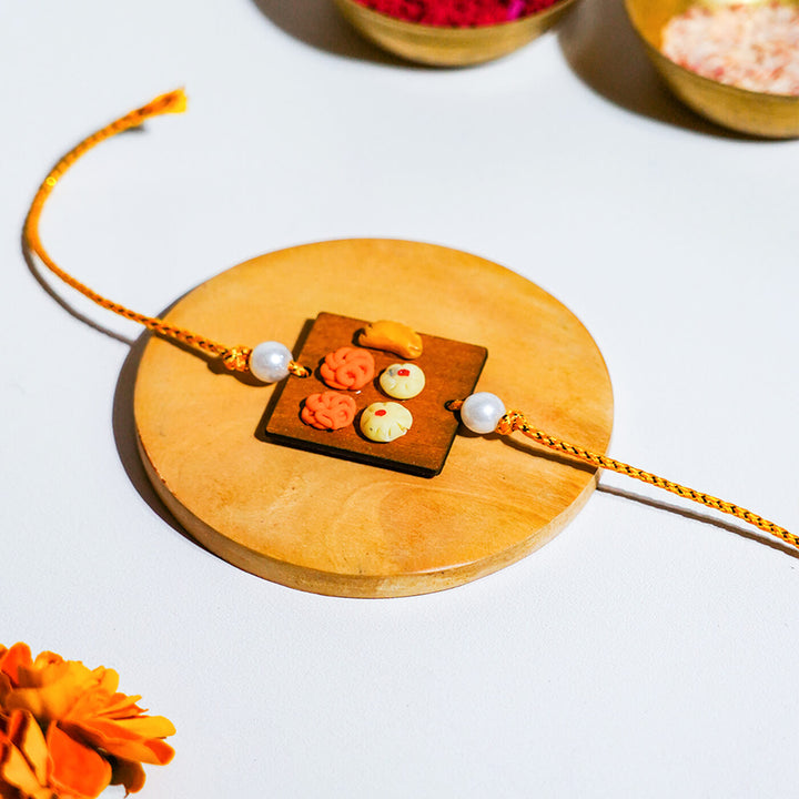 Handmade Food Themed Clay Rakhi 2 - Close-up on Rakhi ornament